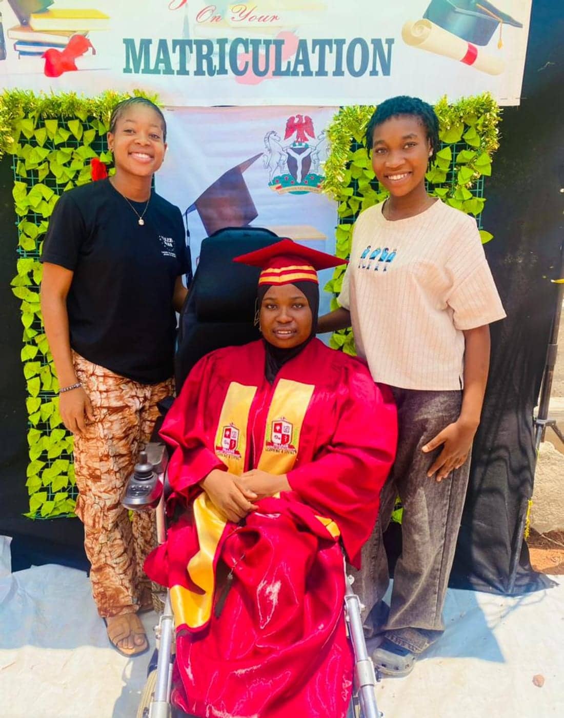Robiat Fasasi in her red matriculation gown and cap at Hillside University of Science and Technology